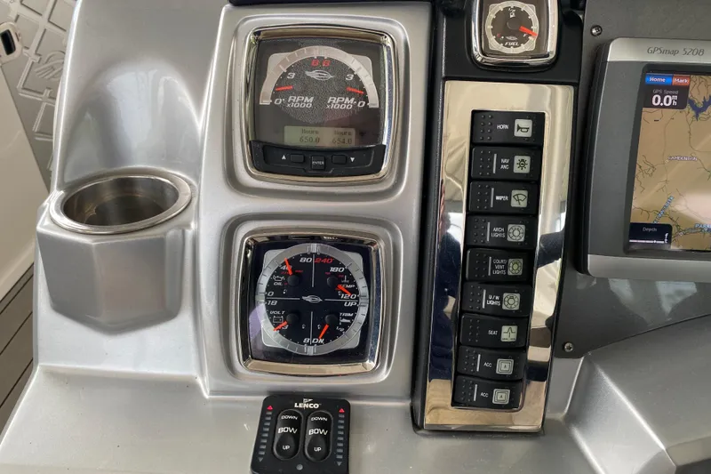 Slide: The Image of Dashboard of a 2012 Chaparral 327 SSX boat with gauges and controls. - 30