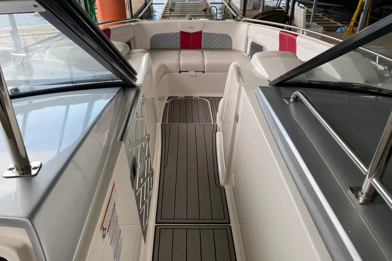 Slide: The Image of 2012 Chaparral 327 SSX boat interior with sleek seating and modern design. - 34