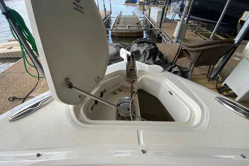 Slide: The Image of Open anchor compartment on 2012 Chaparral 327 SSX boat at dockside. - 39