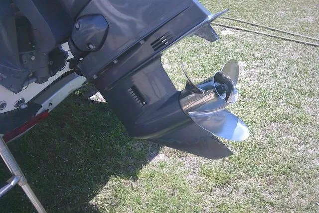 Slide: The Image of Outboard motor of 2018 Key West 1720 Center Console boat on grass. - 11