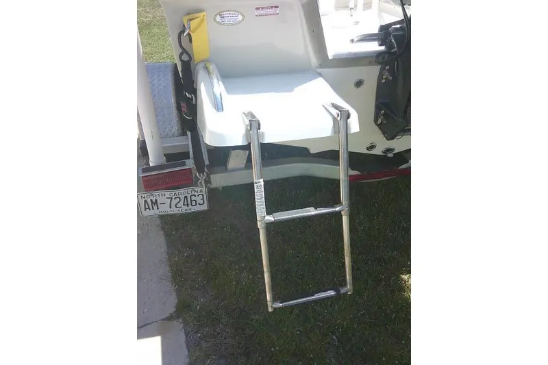 Slide: The Image of 2018 Key West 1720 Center Console boat with ladder and North Carolina license plate. - 12