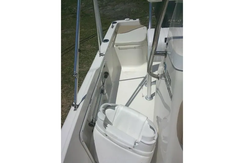 Slide: The Image of 2018 Key West 1720 Center Console boat interior with seating and railing. - 17
