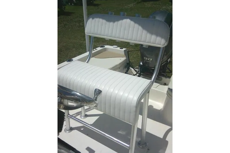 Slide: The Image of 2018 Key West 1720 Center Console boat seat with white upholstery and Yamaha 90 engine. - 18