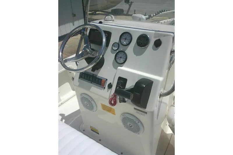 Slide: The Image of 2018 Key West 1720 Center Console boat dashboard with steering wheel and gauges. - 23