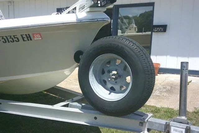 Slide: The Image of 2018 Key West 1720 Center Console boat on trailer, close-up of wheel and hull. - 3
