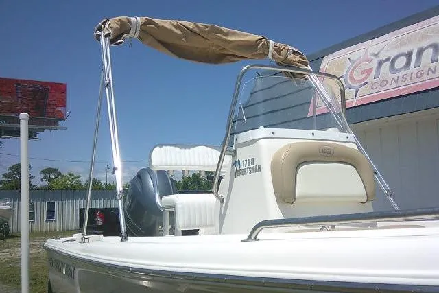 Slide: The Image of 2018 Key West 1720 Center Console boat with canopy, parked outdoors. - 5
