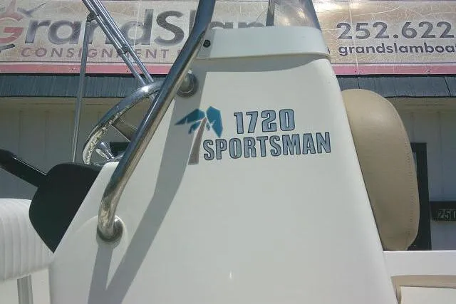 Slide: The Image of 2018 Key West 1720 Center Console boat with "1720 Sportsman" logo, steering wheel visible. - 6