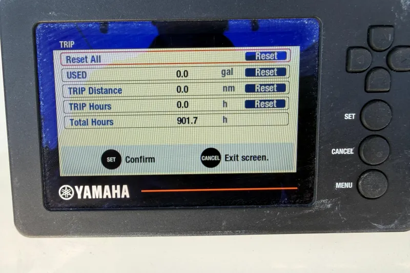 Slide: The Image of Yamaha display showing trip data with 901.7 total hours on Parker 2100 Center Console, 2016 model. - 10