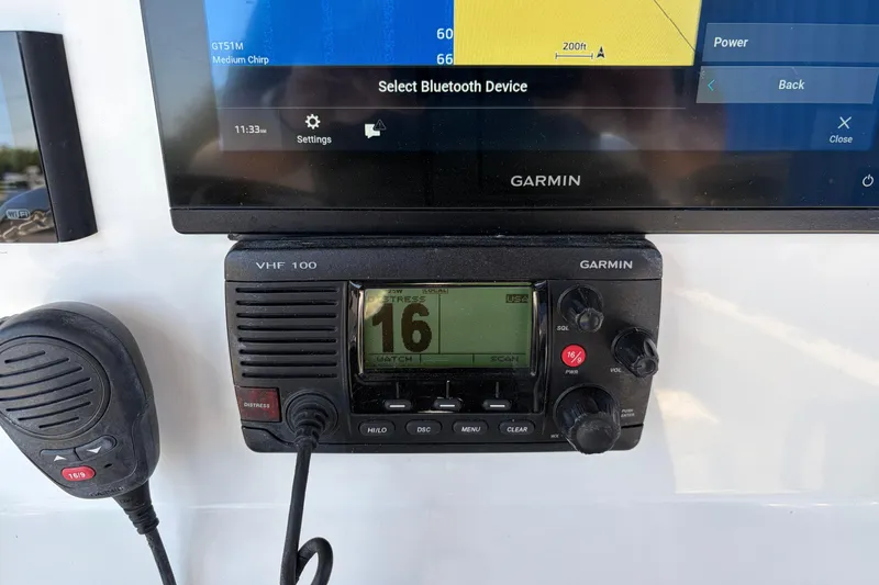 Slide: The Image of Garmin VHF 100 radio and display on 2016 Parker 2100 Center Console boat. - 11