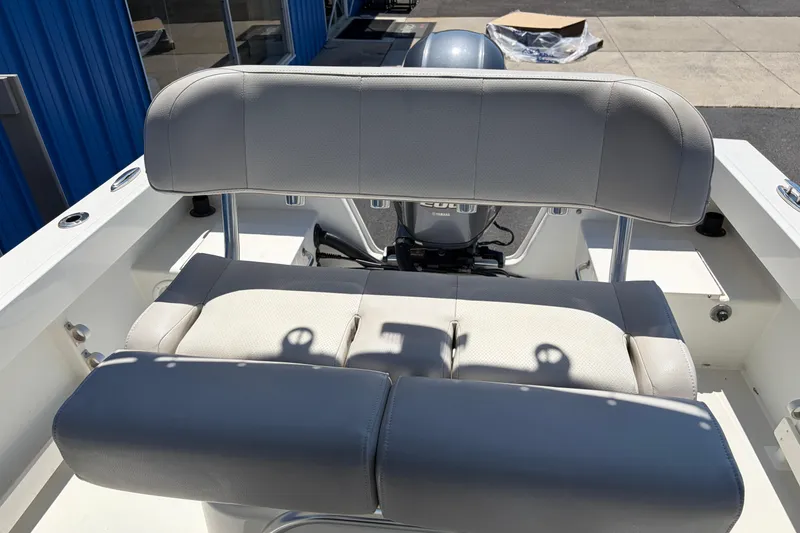 Slide: The Image of 2016 Parker 2100 Center Console boat with cushioned seating and Yamaha engine. - 15