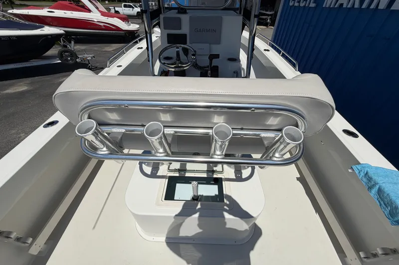 Slide: The Image of 2016 Parker 2100 Center Console boat with rod holders and Garmin equipment. - 17