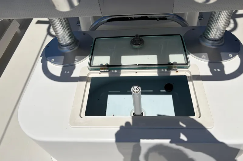 Slide: The Image of Livewell compartment on a 2016 Parker 2100 Center Console boat. - 18