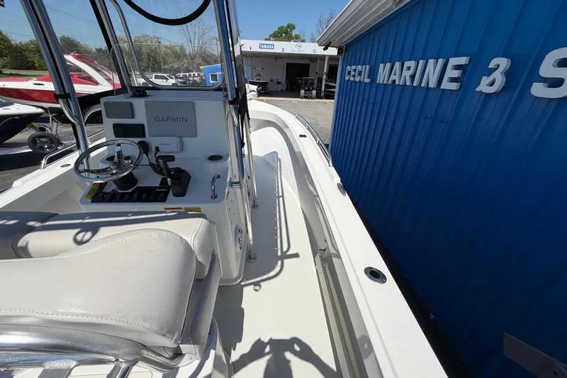 Slide: The Image of 2016 Parker 2100 Center Console boat at Cecil Marine dealership, featuring Garmin navigation. - 23