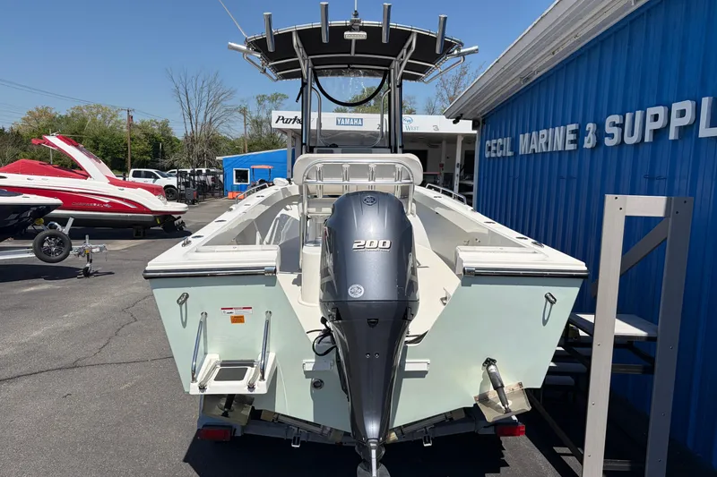 Slide: The Image of 2016 Parker 2100 Center Console boat with Yamaha 200 engine at marine supply store. - 4