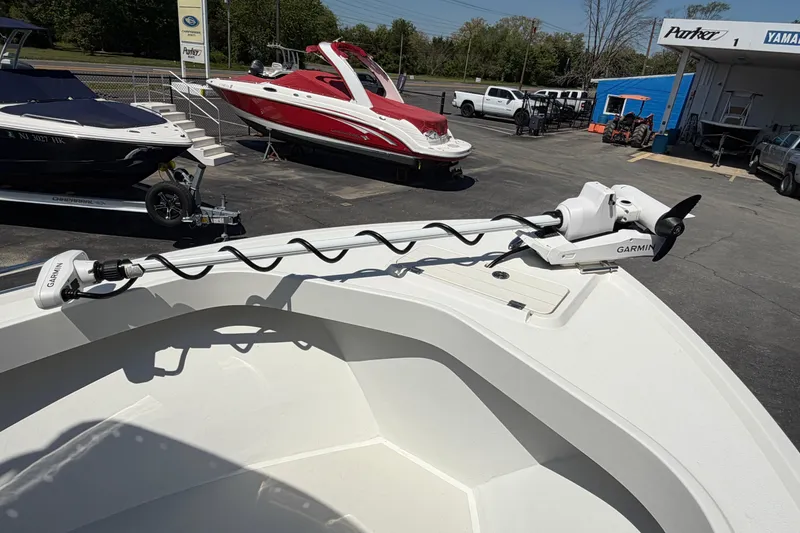 Slide: The Image of 2016 Parker 2100 Center Console boat with Garmin trolling motor in a dealership lot. - 7