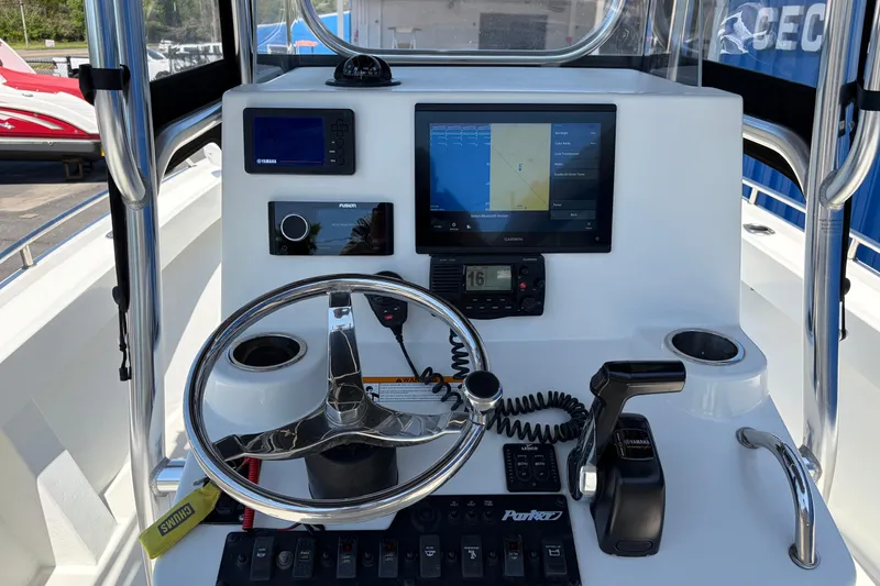 Slide: The Image of Center console of a 2016 Parker 2100 boat with navigation and control systems. - 8