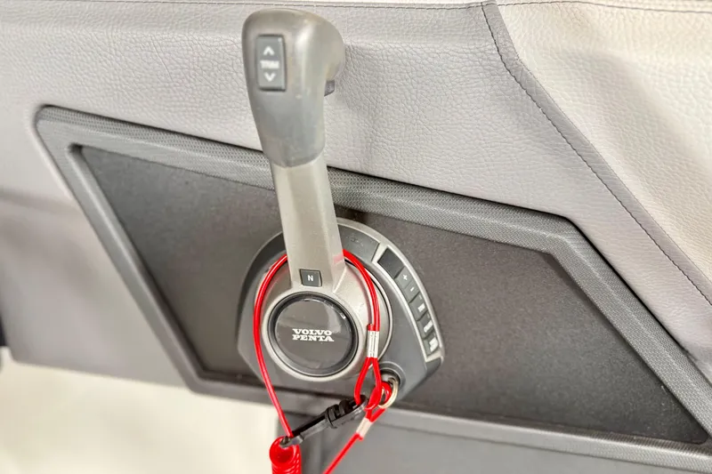 Slide: The Image of Close-up of a Volvo Penta throttle control in a 2023 Cobalt R6 boat. - 13