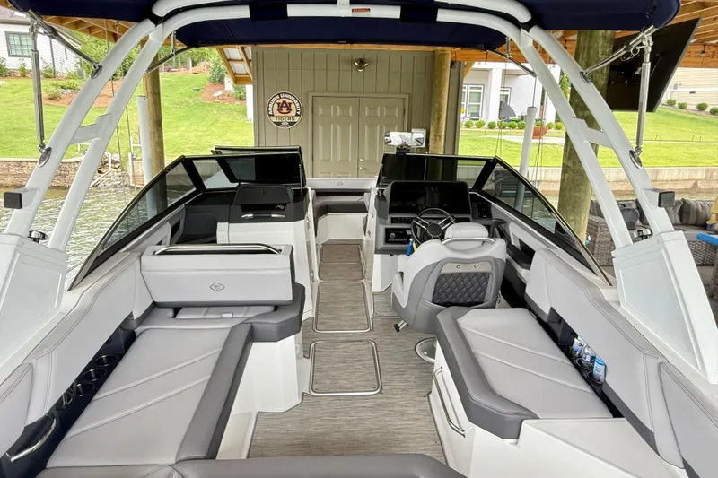 Slide: The Image of 2023 Cobalt R6 boat interior with sleek seating and modern dashboard design. - 19
