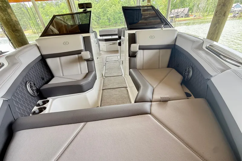 Slide: The Image of 2023 Cobalt R6 boat interior with luxurious seating and scenic lake view. - 6