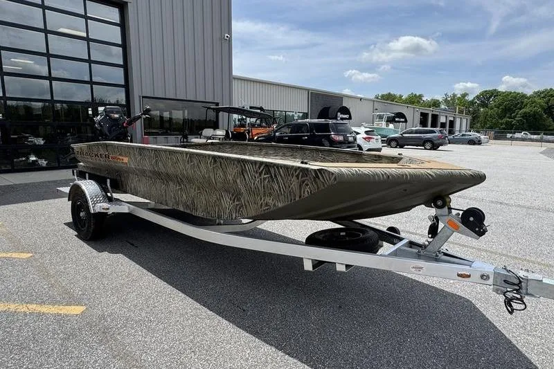 Slide: The Image of 2026 Tracker Grizzly 1756 T Marsh boat on trailer outside dealership. - 14