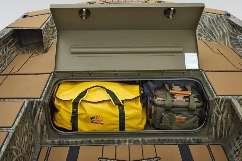 Slide: The Image of Storage compartment of 2026 Tracker Grizzly 1756 T Marsh boat with gear bags. - 15
