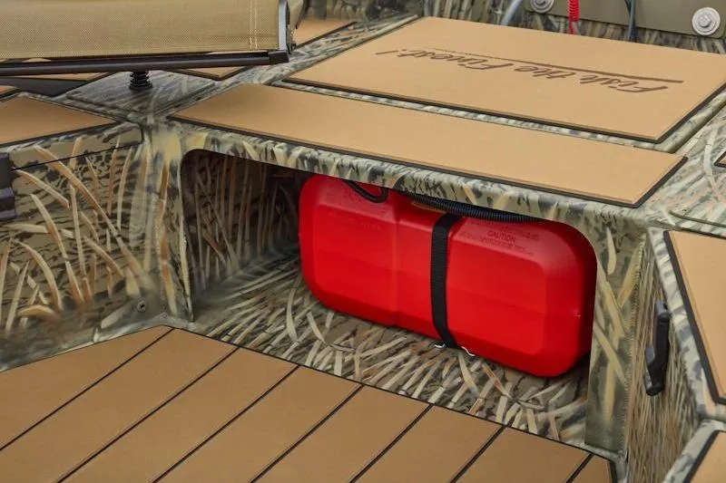 Slide: The Image of 2026 Tracker Grizzly 1756 T Marsh boat interior with camo design and red fuel tank. - 16