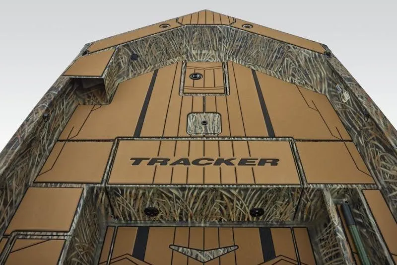 Slide: The Image of 2026 Tracker Grizzly 1756 T Marsh boat with camouflage design and storage compartments. - 18