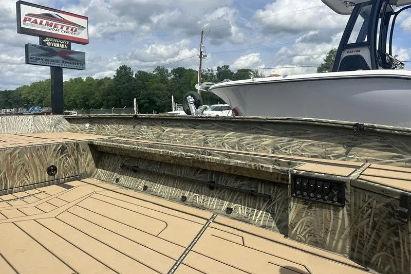 Slide: The Image of 2026 Tracker Grizzly 1756 T Marsh boat with camouflage design at Palmetto Boat Center. - 4