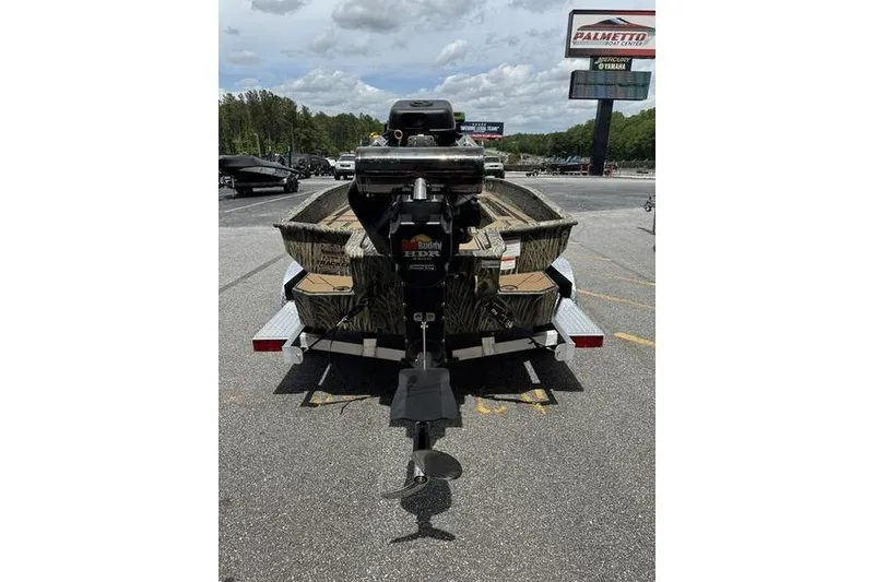 Slide: The Image of 2026 Tracker Grizzly 1756 T Marsh boat on trailer, rear view in parking lot. - 5