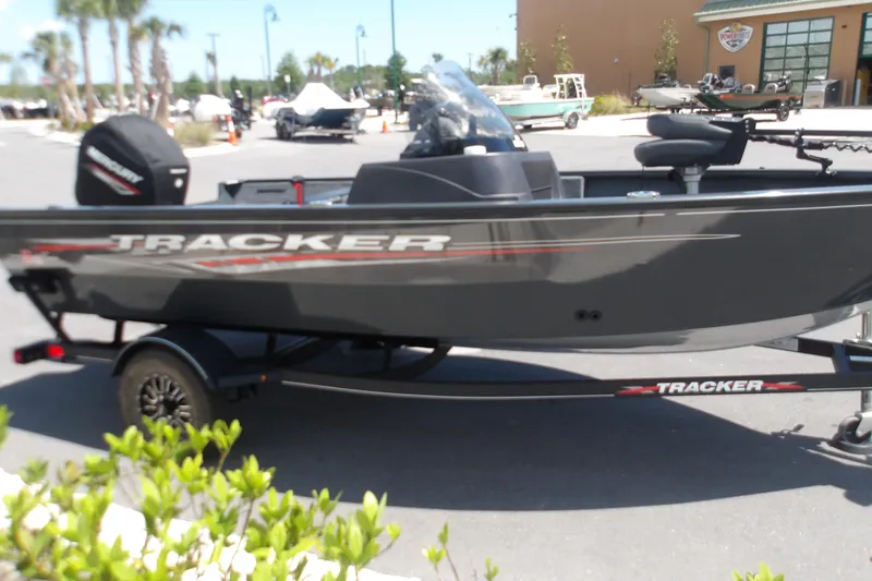 Slide: The Image of 2021 Tracker Pro Guide V-16 SC boat on trailer in outdoor setting. - 3