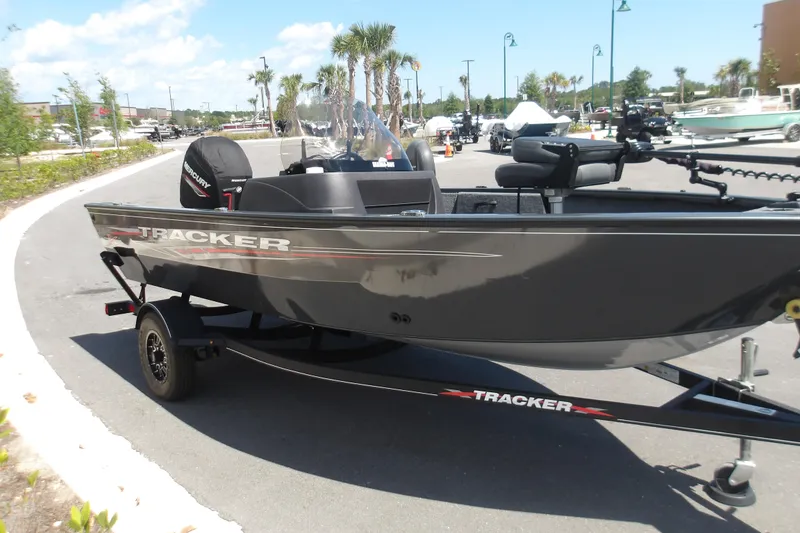 Slide: The Image of 2021 Tracker Pro Guide V-16 SC boat on trailer, parked outdoors. - 4