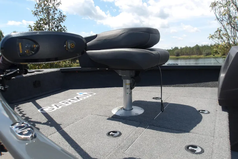 Slide: The Image of 2021 Tracker Pro Guide V-16 SC boat interior with Garmin equipment and seating. - 5