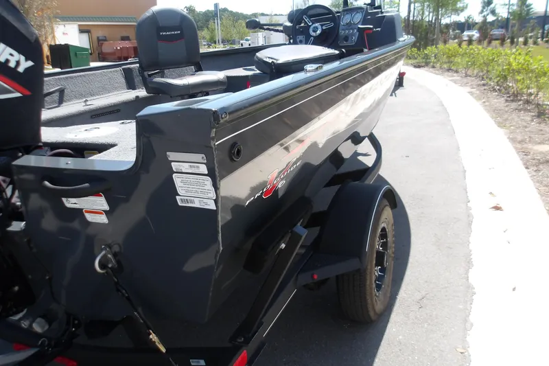Slide: The Image of 2021 Tracker Pro Guide V-16 SC boat on trailer, parked outdoors. - 8