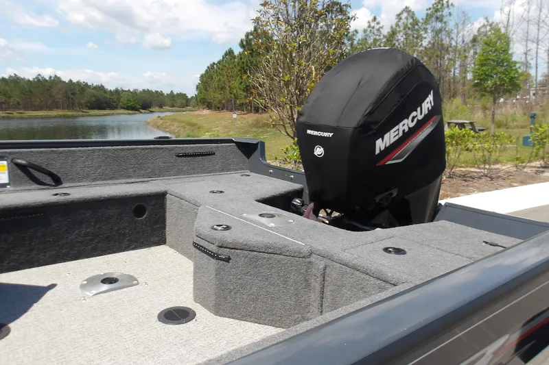 Slide: The Image of 2021 Tracker Pro Guide V-16 SC boat with Mercury engine by a scenic lake. - 9