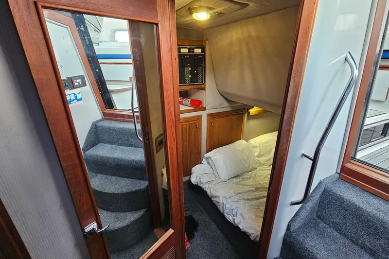 Slide: The Image of Interior of 1988 Regal Commodore 360 yacht with cozy cabin and carpeted stairs. - 17
