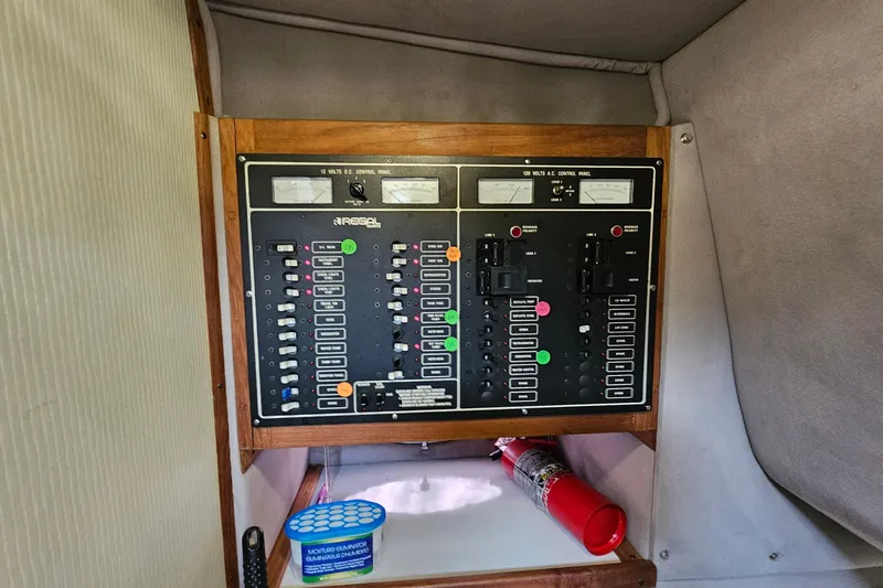 Slide: The Image of Electrical control panel in a 1988 Regal Commodore 360 boat interior. - 19