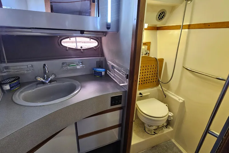 Slide: The Image of Bathroom interior of 1988 Regal Commodore 360 yacht with sink and toilet. - 20