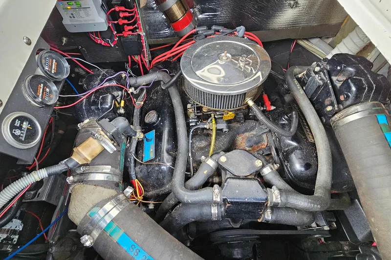 Slide: The Image of Engine compartment of a 1988 Regal Commodore 360 boat, showing detailed wiring and components. - 22