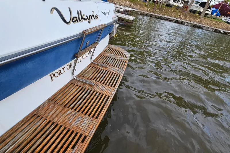 Slide: The Image of 1988 Regal Commodore 360 boat named Valkyrie docked at a marina. - 3