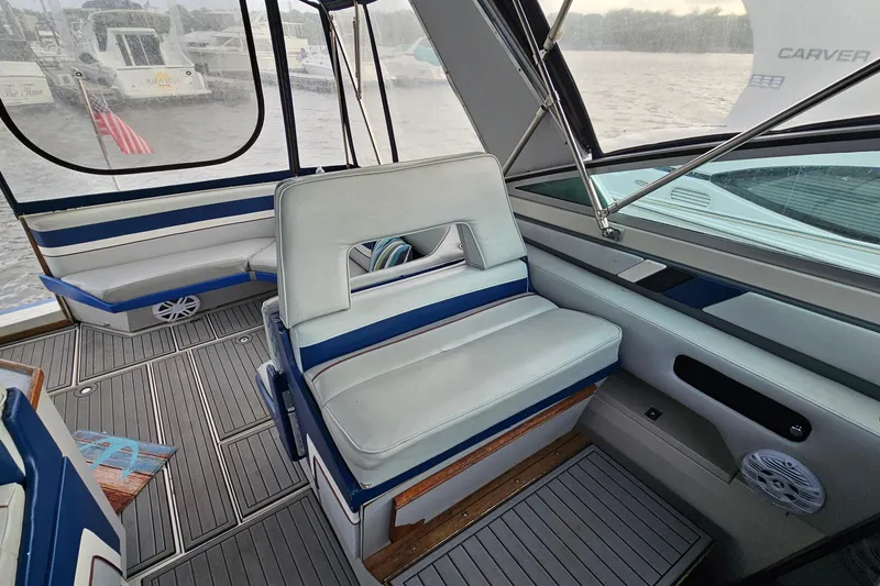 Slide: The Image of Interior of 1988 Regal Commodore 360 boat with blue and white seating. - 7