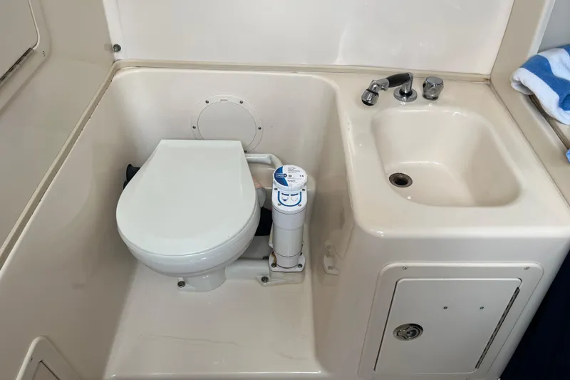 Slide: The Image of Boat head compartment with toilet and sink - 11