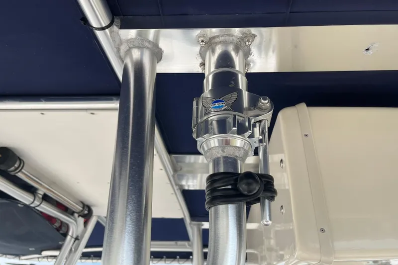 Slide: The Image of Close-up of a 2002 Grady-White Bimini 306 boat's metal structure and fittings. - 16