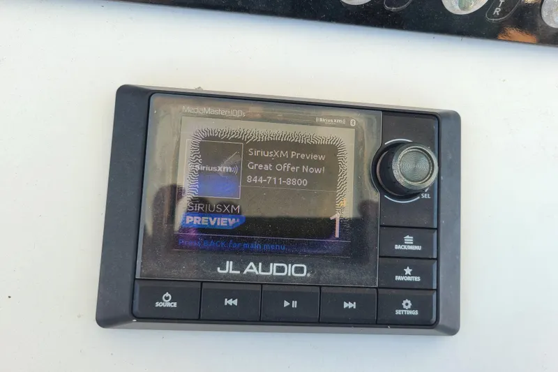 Slide: The Image of JL Audio MediaMaster display on 2021 Sportsman Open 242 Center Console boat. - 10