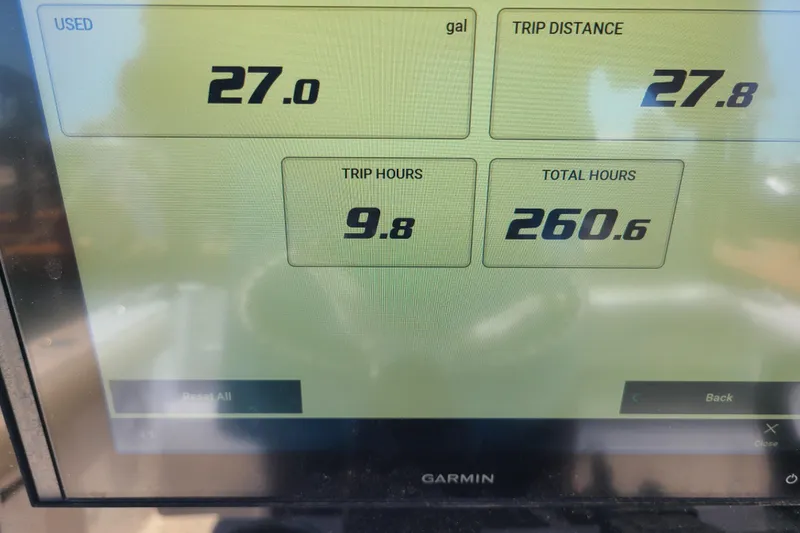 Slide: The Image of Garmin display showing fuel usage and trip data for Sportsman Open 242 Center Console, 2021. - 13