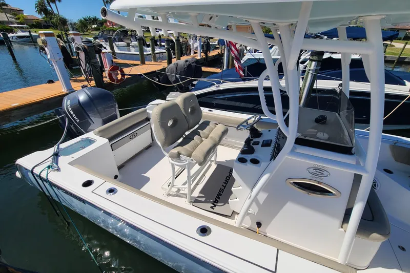 Slide: The Image of 2021 Sportsman Open 242 Center Console boat docked at marina. - 17