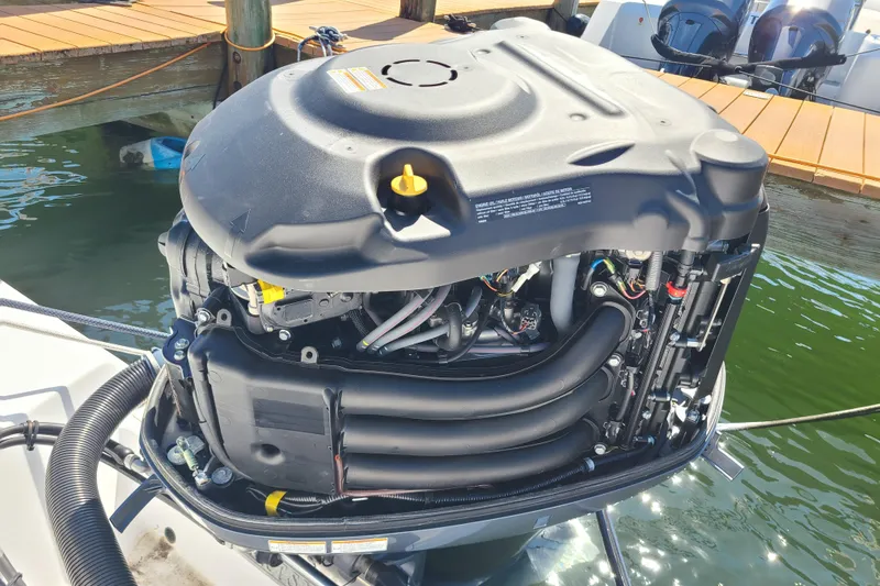 Slide: The Image of Open 242 Center Console 2021 outboard motor, detailed view at dockside. - 28