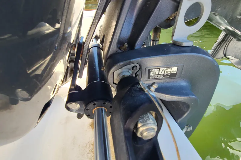Slide: The Image of Close-up of Yamaha F300XCA engine on 2021 Sportsman Open 242 Center Console boat. - 29