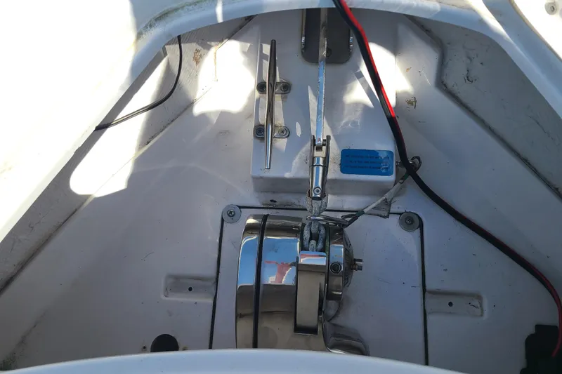 Slide: The Image of 2021 Sportsman Open 242 Center Console anchor locker with winch and wiring. - 7