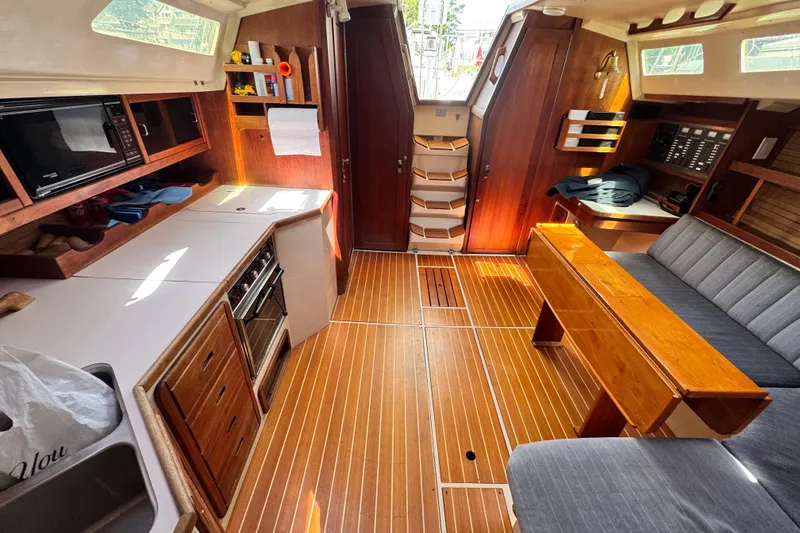Slide: The Image of Interior of a 1990 Catalina 42 MkII sailboat with wood finish and modern amenities. - 15