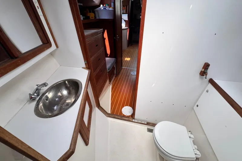 Slide: The Image of Bathroom interior of a 1990 Catalina 42 MkII yacht with sink and toilet. - 32